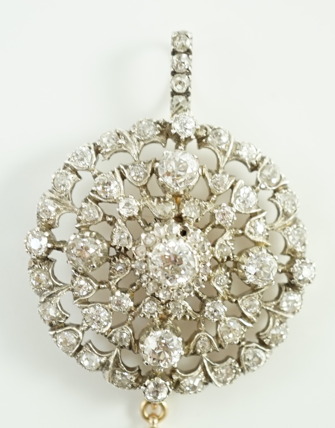 A Victorian gold, silver and graduated diamond cluster set target drop pendant brooch, retailed by Carlo & Arthur Giuliano